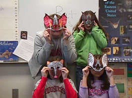 The authors of this week\'s entry hide behind bat masks they created with instructions from the educator\'s book that is part of the "bat trunk" that Bat Project classes can plunge into. Courtesy photo
