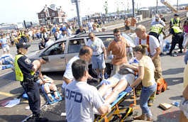 Police and emergency personnel from New London, Conn., and surrounding towns tend to victims of a accident Saturday next to the New London train station. Jeff Evans | Associated Press