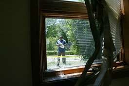 Abdul Mohammed videotapes the damage caused by the firebombing of the Bloomington mosque in this July 9, 2005, file photo. Jeremy Hogan | Herald-Times