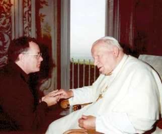 Father Rick Eldred kneels and listens to Pope John Paul II speak in 1998. Eldred was in Rome to witness the Beatification of Sister Theodore Guerin. Photo submitted by Father Rick Eldred.