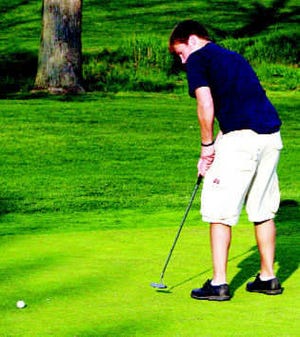 Martinsville\'s Sam Maxwell watches his putt during the match against Monrovia at Foxcliff Golf Club earlier this season. On Wednesday, Maxwell earned medalist honors by shooting a one-over-par 36 during the Artesians\' match with Edgewood at the Cascades Golf Club in Bloomington. Photo by Steve Page.