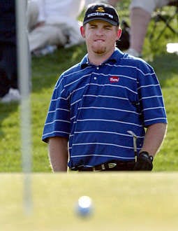 J.B. Holmes watches his birdie chipon No. 18 stop inches from the holeduring the third round of the FBROpen Saturday. Holmes leads with16-under.Robert Scott Button | Associated Press
