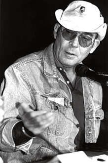 ** FILE **Hunter S. Thompson gestures during his part of the Great Vote Hunt 95 on Sept. 23, 1995, in Aspen, Colo. Thompson, the acerbic counterculture writer who popularized a new form of fictional journalism in books like "Fear and Loathing in Las Vegas," fatally shot himself Sunday night, Feb. 20, 2005, at his Aspen-area home, his son said. He was 67. (AP Photo/Aspen Daily News, Michael R. Brands, File)
