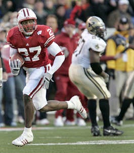 Wisconsin\'s Jack Ikegwuonu returns a 62-yard interception for a touchdown against Purdue in Madison, Wis., Saturday as the Badgers beat the Boilermakers, 31-20. Andy Manis | Associated Press
