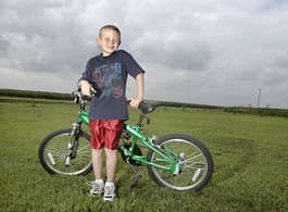 Chandler Henry, seen here Monday in Otterbein, won this bike for having perfect attendance last year at Otterbein Elementary School. Chandler\'s name was entered in a drawing with other Otterbein students who got to class on time every day. Frank Oliver | Associated Press