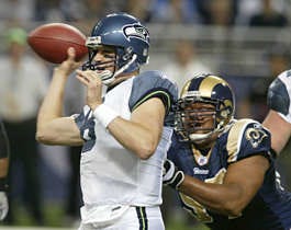 Seattle quarterback Matt Hasselbeck gets off a pass under pressure from St. Louis\'s Tyoka Jackson during the first quarter Sunday. The Seahawks won 37-31.Tom Gannam | Associated Press