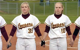 North softball pitchers Emily Crohn (left) and Danielle Hobbs (right) hold hands with their teammates during the national anthem before a game on May 3, 2005.Chris Howell | Herald-Times