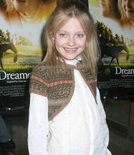 Actress Dakota Fanning poses for photographers as she arrives for a special screening of her new film "Dreamer" Monday Oct. 17, 2005 in New York. (AP Photo/Tina Fineberg)
