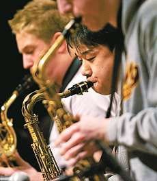 Bloomington North saxophonists, from front, Jacob Ebling, David Kim and Chris Wojciechowski, practice for tonight\'s send-off concert. Staff photo by David Snodgress