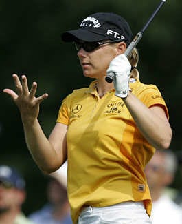 Annika Sorenstam looks at her right hand after it slipped off her club during her tee shot on the 13th hole in the third round of the LPGA Championship Saturday. Chris Gardner | Associated Press