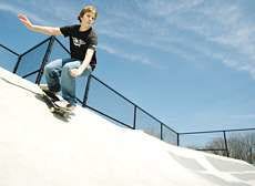 Andrew Pinnick, 12, of French Lick, skateboards Thursday at Bloomington\'s skateboard park in Upper Cascades Park. Pinnick said skateboarding is illegal in French Lick and that skateboarders are subject to up to a $2,000 fine. Pinnick is spending a couple of days skateboarding in Bloomington during spring break. Staff photo by Jeremy Hogan