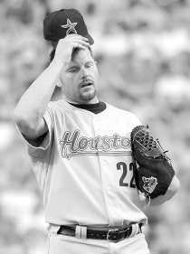 Houston pitcher Roger Clemens awaits another batter after walking Cincinnati\'s Austin Kearns with the bases loaded in the third inning Saturday. AP Photo.