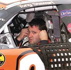 Tony Stewart sits in his car after practice last weekend at the New Hampshire Speedway. Stewartl, who continues to be under fire for his driving tactics, has finished in the top five in his last three races, including his only win of the season. AP Photo.