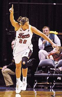 Stephanie White celebrates a 3-point basket in the Indiana Fever\'s 70-62 victory over Houston Wednesday. AP Photo.