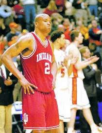 Indiana\'s A.J. Moye (2) shows his disappointment as Illinois players applaud their 71-59 victory over the Hoosiers Friday in the Big Ten Tournament. Staff photo by David Snodgress.