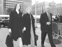 Martha Stewart enters Manhattan federal court holding the hand of her daughter, Alexis, and escorted by her bodyguard, Frank Senerchia, Tuesday in New York. Jurors are expected to begin deliberations in Stewart\'s federal trial today. AP Photo.