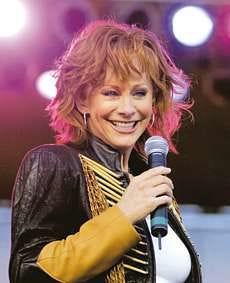 Reba McEntire is one of the headlining acts at this year's Indiana State Fair. She'll perform on the grandstand Aug. 15. AP Photo.