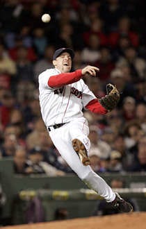 Boston third baseman Bill Mueller throws out New York\'s Derek Jeter at first base in the fifth inning at Fenway Park in Boston Friday. Elise Amendola | Associated Press