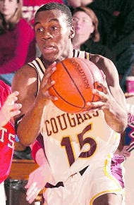 Mike Davis (15) and Errek Suhr are key to North\'s basketball success. H-T File Photo