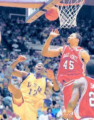 Ball State\'s Lonnie Jones blocks a shot by Louisiana State\'s Ronald Dupree during Tuesday night\'s NIT game in Baton Rouge, La. Ball State won 75-65. AP photo