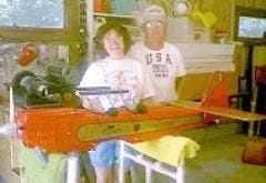 Bill and Jane Black pose inside their airplane shop at their rural Martinsville home, with one of their mini airplanes. Photo by Jo Foster