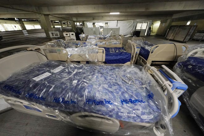 Beds await placement in a yet-to-be-completed section of a COVID-19 mobile field hospital erected in a parking garage at the University of Mississippi Medical Center in Jackson on Thursday.