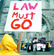 A man protesting against Cardinal Bernard Law faces a group of pro-Law protesters on the steps of the Cathedral of the Holy Cross in Boston on Sunday. AP photo