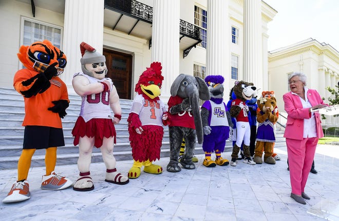 Gov. Kay Ivey gathers with student leaders and mascots from state colleges and universities to promote College Colors Day at the state Capitol in Montgomery, Ala., on Thursday. College Colors Day, Sept. 3, is an annual occasion on which Alabamians are asked to show their school pride.