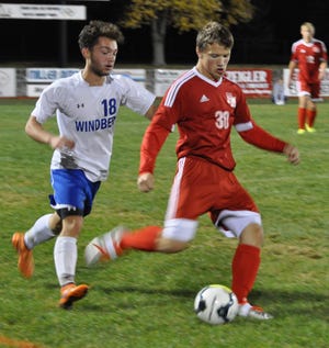 Windber’s Evan Mihalko battles Fannett-Metal’s Frankie Ryder for the ball in the first half of the District 5 Class A boys soccer championship game at Northern Bedford’s Panther Community Stadium.