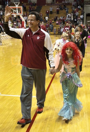 Indiana basketball coach Tom Crean leads the Halloween costume parade with his daughter Ainsley, who is dressed as Ariel from "The Little Mermaid."  After the parade, the hundreds of costumed kids had their picture taken with the IU men's basketball team.