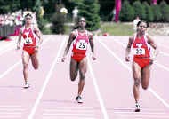 Indianas Rachelle Boone (23) leads a 1-3-5-7 finish by the Hoosiers in the 200 meters during Sundays final day of the Big Ten Outdoor Track and Field Championships. Danielle Carruthers (25) was third and Tia Trent (41) was seventh. Lorraine Dunlop finished fifth. Staff photo by Monty Howell