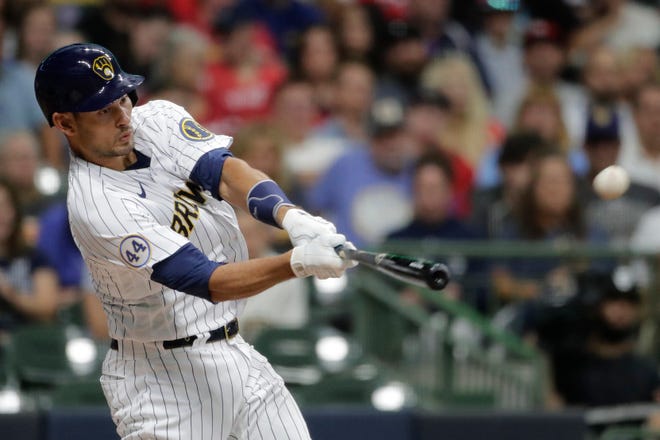 Milwaukee Brewers' Luke Maile hits an RBI-double during the second inning of a baseball game against the St. Louis Cardinals, Saturday, Sept. 4, 2021, in Milwaukee. (AP Photo/Aaron Gash)