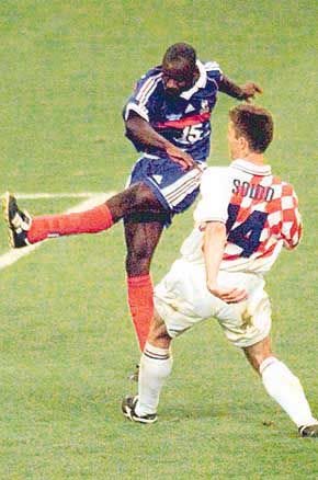 France\'s Lilian Thuram (left) follows through on the winning goal in front of Croatia\'s Zvonimir Soldo during France\'s 2-1 win in the World Cup semifinals on Wednesday. AP photo