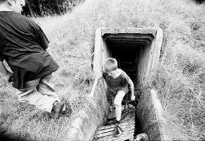 Schoolboys Paul, left, and Marcel emerge from a bunker of the East German border troops in Selmsdorf, former East Germany, Sept. 26. In the 10 years since the Iron Curtain came down many of the physical scars have been erased, some are left behind as reminders. AP photo