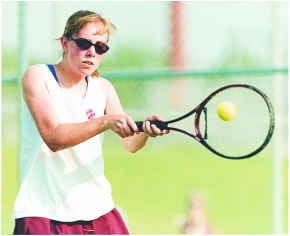 South\'s Betsy Edgeworth returns a shot during her 6-4, 6-2 loss to North\'s Emily Williams at No. 1 singles during Monday\'s match at South. Staff photo by Jeremy Hogan
