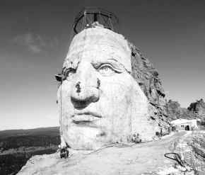 Workers continue work carving the Crazy Horse memorial in the Black Hills of South Dakota on April 15. The project, begun 50 years ago, will be the largest sculpture on Earth when finished. The stone carving of the American Indian leader sitting atop his stallion will be 563 feet high and 641 feet long. AP PHOTO