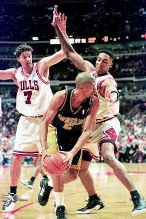 Chicago\'s Toni Kukoc (left) and Scottie Pippen double-team Indiana\'s Jalen Rose during Game 1 of the Eastern Conference finals on Sunday at the United Center in Chicago. The Bulls forced 26 turnovers en route to a 85-79 win and 1-0 lead in the best-of-7 series. AP Photo