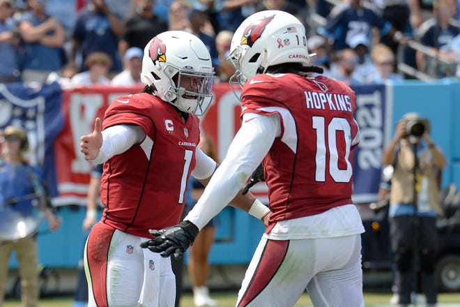 Arizona Cardinals quarterback Kyler Murray (1) is congratulated by wide receiver DeAndre Hopkins (10) after Murray ran for a touchdown against the Tennessee Titans in the first half of an NFL football game Sunday, Sept. 12, 2021, in Nashville, Tenn. (AP Photo/Mark Zaleski)