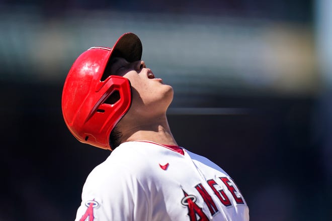 Los Angeles Angels' Shohei Ohtani, of Japan, reacts after he was out on a bunt-attempt during the sixth inning of a baseball game against the Oakland Athletics, Sunday, Sept. 19, 2021, in Anaheim, Calif. (AP Photo/Jae C. Hong)