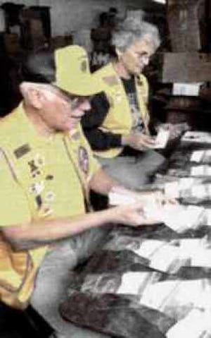 Lions members from elsewhere in the U.S. cleaning and packaging used eyeglasses according to their prescriptions. Local Lions also collect used glasses for needy people in developing countries at locations around this community.