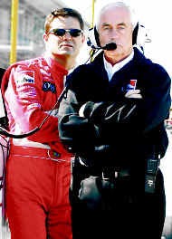 Car owner Roger Penske (right), and driver Gil de Ferran await the beginning of qualifications Saturday at Indianapolis Motor Speedway. AP photo