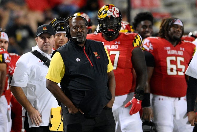 Maryland head coach Michael Locksley, foreground, watches from the sideline during the second half of an NCAA college football game against Howard, Saturday, Sept. 11, 2021, in College Park, Md. (AP Photo/Nick Wass)