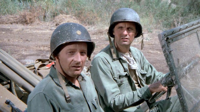Larry Linville (Maj. Frank Burns) with Alan Alda in a scene from "M*A*S*H," which aired from 1972-83 and set an unbeaten record with 105 million viewers for its finale.