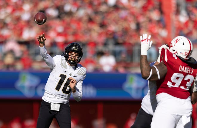 Purdue quarterback Aidan O'Connell (16) passes the ball against Nebraska during the first half of an NCAA college football game Saturday, Oct. 30, 2021, at Memorial Stadium in Lincoln, Neb. (AP Photo/Rebecca S. Gratz)