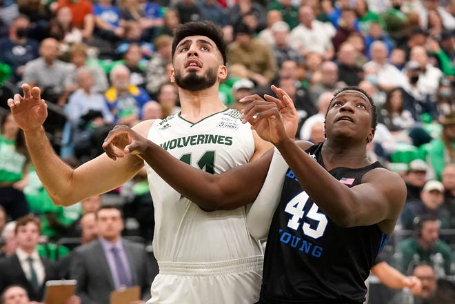 Utah Valley center Fardaws Aimaq (11) and BYU forward Fousseyni Traore (45) battle for position under the boards in the first half during an NCAA college basketball game Wednesday, Dec. 1, 2021, in Orem, Utah. (AP Photo/Rick Bowmer)