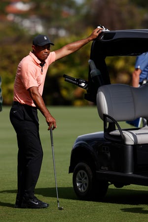 Tiger Woods watches play from his golf cart during the first round of the PNC Championship golf tournament Saturday, Dec. 18, 2021, in Orlando, Fla. (AP Photo/Scott Audette)