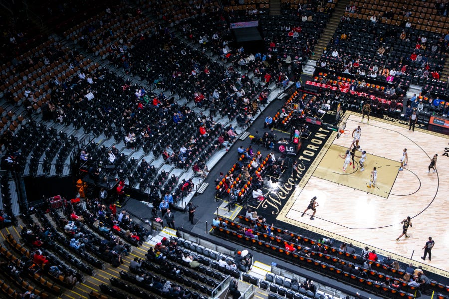 A provincial mandate in Canada dictates 50% capacity at indoor sporting events in a bid to combat the spread of the omicron COVID-19 variant, leaving empty seats at Scotiabank Arena as the Toronto Raptors take on the Golden State Warriors in an NBA basketball game Dec. 18.
