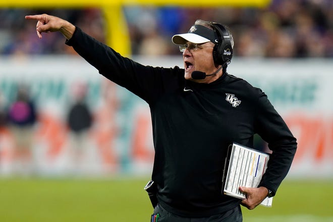 Central Florida head coach Gus Malzahn calls a play during the second half of the Gasparilla Bowl NCAA college football game against Florida Thursday, Dec. 23, 2021, in Tampa, Fla. (AP Photo/Chris O'Meara)