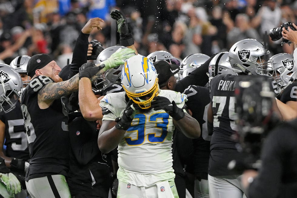 Los Angeles Chargers defensive tackle Justin Jones (93) removes his helmet after the Los Angeles Chargers lost to the Las Vegas Raiders in overtime of an NFL football game, Sunday, Jan. 9, 2022, in Las Vegas. (AP Photo/David Becker)