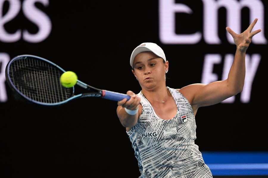 Ash Barty of Australia plays a forehand return to Madison Keys of the U.S. during their semifinal match at the Australian Open tennis championships in Melbourne, Australia, Thursday, Jan. 27, 2022. (AP Photo/Andy Brownbill)